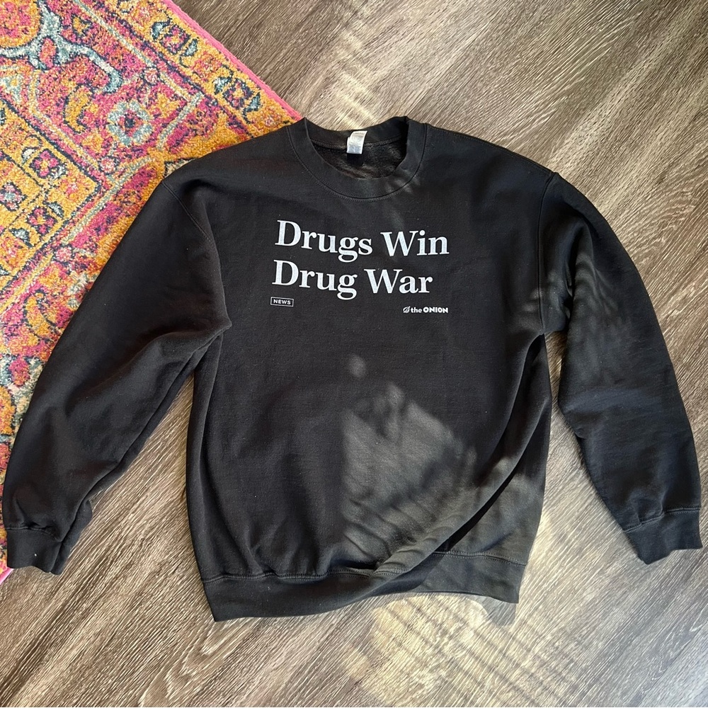Drugs Win Drug War crewneck from The Onion online store